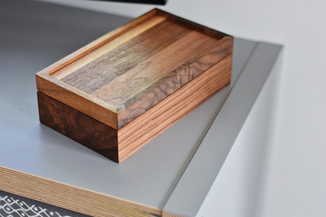 A Walnut and Maple Keepsake Box with a Striped Lid